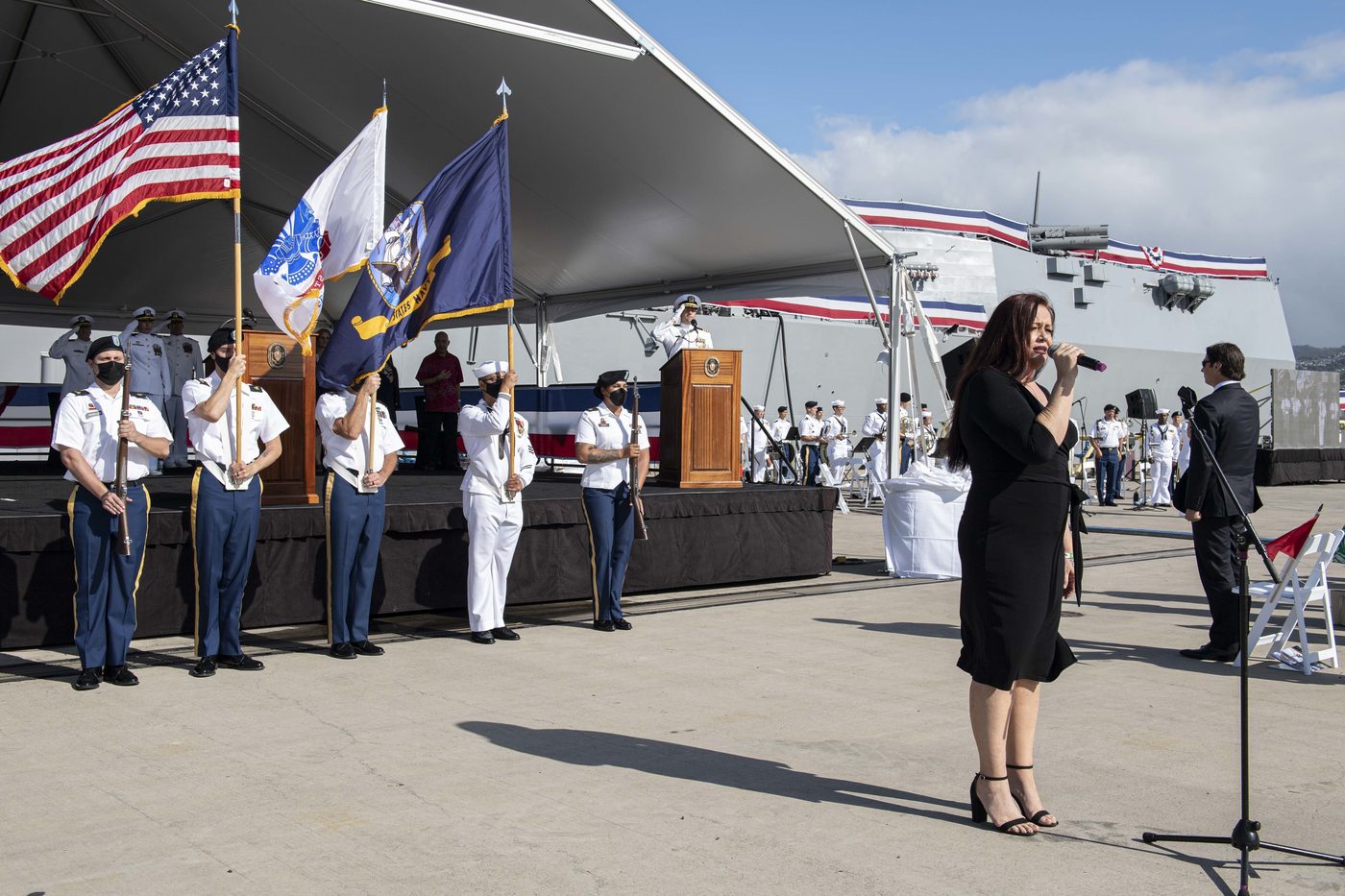 Amy Hānaialiʻi performing the Hawaiian state anthem at the December 2021 commissioning of USS Daniel Inouye at Pearl Harbor