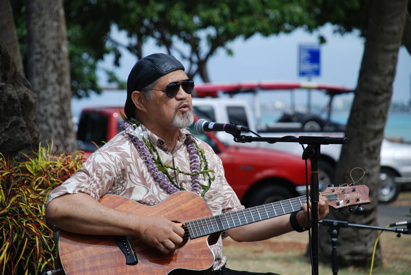 Cyril Pahinui playing slack-key guitar at the Waikiki Natatorium War Memorial in 2012